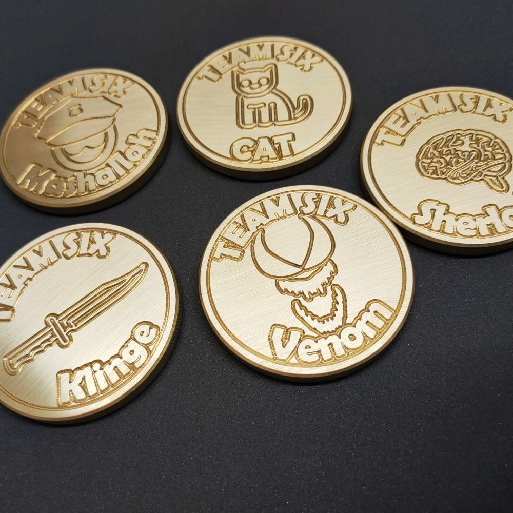 Some brass coins milled and engraved on my CNC mill